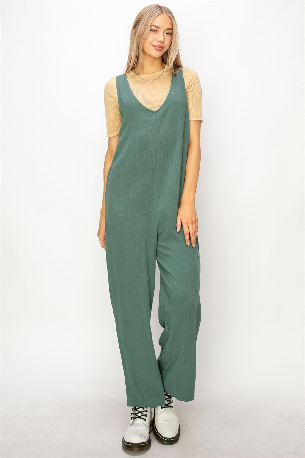 sleeveless deep v-neck linen jumpsuit with wide legs and relaxed fit